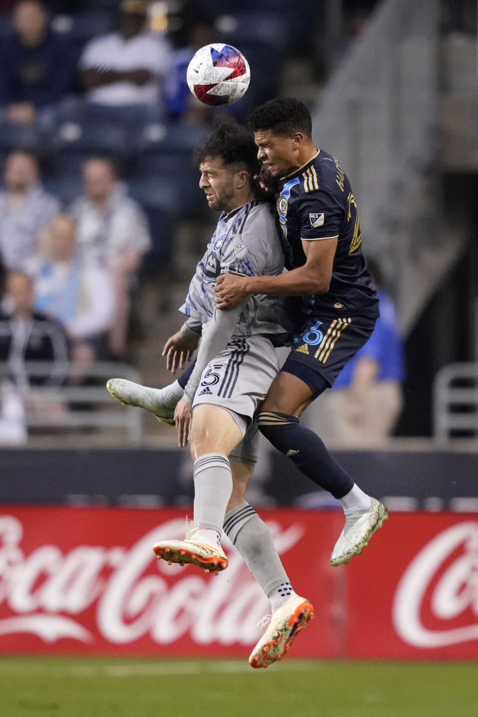 CF Montréal's Ilias Iliadis, left, and Philadelphia Union's Nathan Harriel leap for the ball during the first half of an MLS soccer match, Saturday, June 3, 2023, in Chester, Pa. (AP Photo/Matt Slocum)