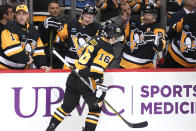 Pittsburgh Penguins' Jason Zucker (16) returns to the bench after scoring during the second period of the team's NHL hockey game against the St. Louis Blues in Pittsburgh, Saturday, Dec. 3, 2022. (AP Photo/Gene J. Puskar)