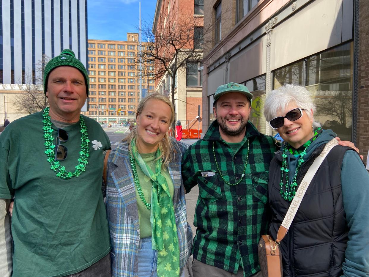 Jim Waide of Avon and his wife, Joanne, (far right) were talking to friends of her daughter — Neil Streiff and Lindsay Schwab (middle) of Gates — as the music swelled and the Rochester St. Patrick's Day parade officially began.