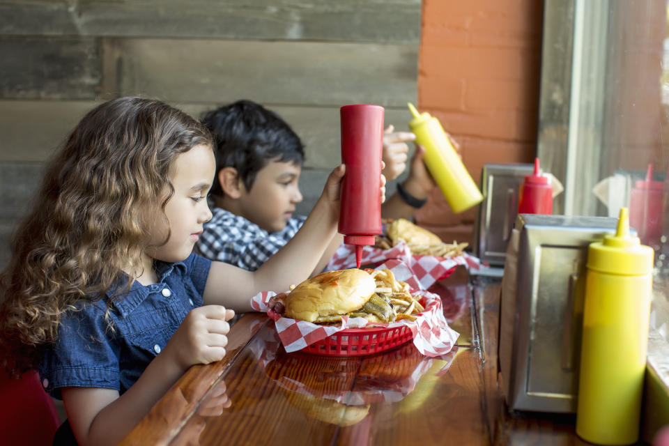 Should kids be banned from certain restaurants? Some establishments are creating policies to prevent children of certain ages from dining. (Photo via Getty Images)