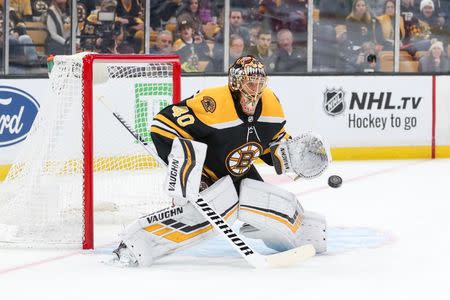 Oct 13, 2018; Boston, MA, USA; Boston Bruins goalie Tuukka Rask (40) blocks a shot by Detroit Red Wings center Gustav Nyquist (14) during the first period at TD Garden. Mandatory Credit: Paul Rutherford-USA TODAY Sports