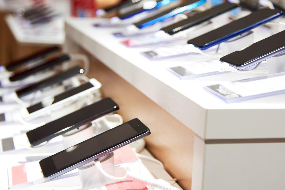 Smartphone's on the counter of a modern electronics store