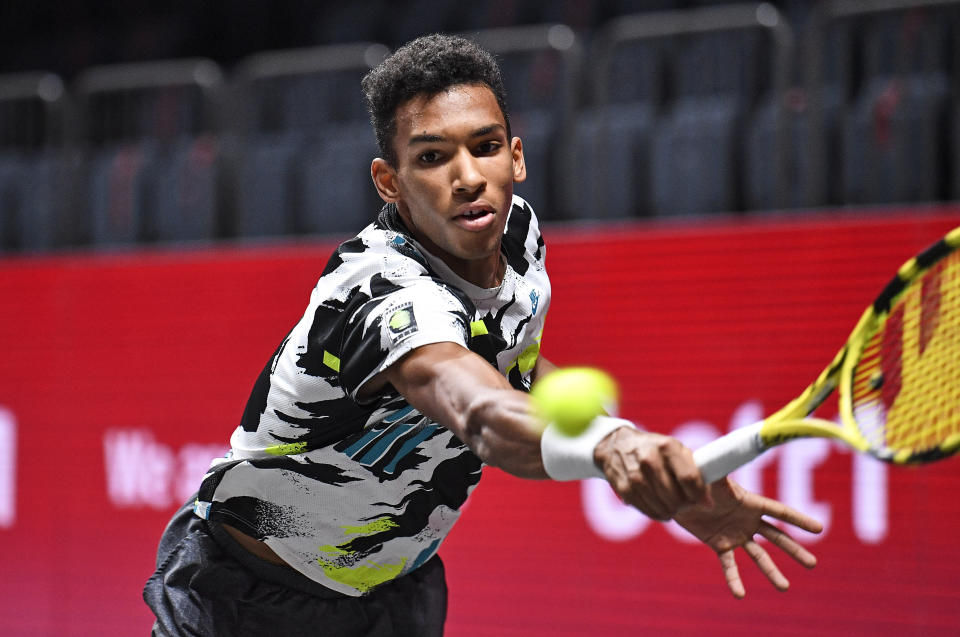 Canada's Felix Auger-Aliassime returns the ball during the ATP bett1HULKS Indoors tennis final against Germany's Alexander Zverev in Cologne, Germany, Sunday, Oct. 18, 2020. (AP Photo/Martin Meissner)