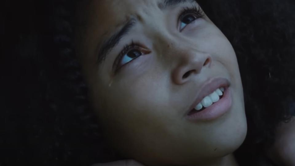 A tear running down Rue's face during a close up during The Hunger Games.