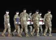 An Army carry team moves a transfer case containing the remains of Spc. Branden Tyme Kimball, early Friday, Feb. 14, 2020, at Dover Air Force Base, Del. According to the Department of Defense, Kimball, 21, of Central Point, Ore., died at Bagram Airfield, Afghanistan, from a non-combat related incident. (AP Photo/Steve Ruark)