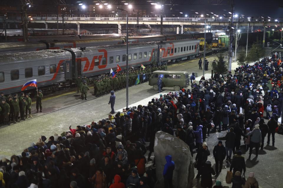 FILE - Soldiers who were recently mobilized by Russia for the military operation in Ukraine stand at a ceremony before boarding a train at a railway station in Tyumen, Russia, Friday, Dec. 2, 2022. Russia, which has suffered humiliating military setbacks in recent months, has called up 300,000 reservists to compensate for its heavy battlefield losses. (AP Photo, File)