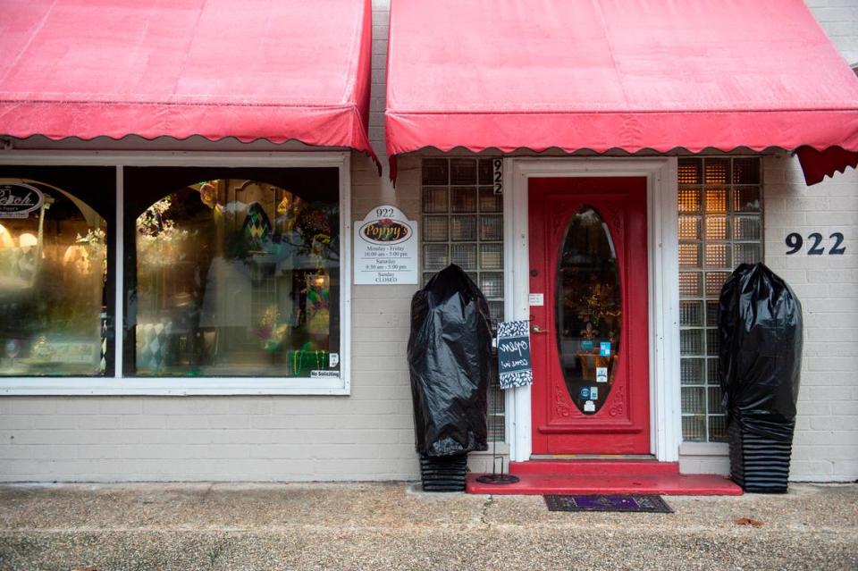 Plants are covered in plastic and tied up outside Poppy’s in Ocean Springs on Tuesday, Jan. 16, 2024. Freezing rain covered plants and roads with icy overnight as temperatures dipped below freezing.