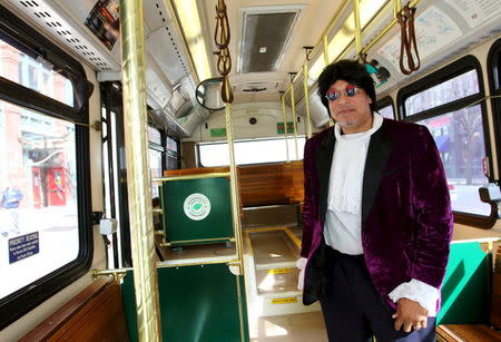 Cloyd Thomas, a Cleveland regional Transit Authority Trolley driver poses as Prince inside his trolley as part of the Rock and Roll Hall of Fame Induction week in Cleveland, Ohio April 15, 2015. REUTERS/Aaron Josefczyk