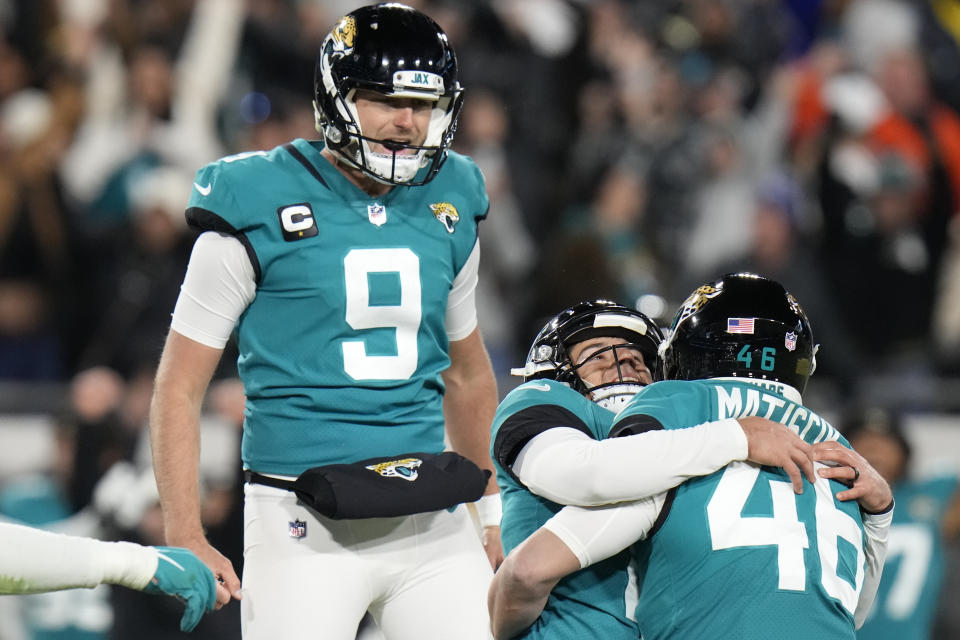 Jacksonville Jaguars place kicker Riley Patterson, center, celebrates his game-winning field goal against the Los Angeles Chargers during the second half of an NFL wild-card football game, Saturday, Jan. 14, 2023, in Jacksonville, Fla. Jacksonville Jaguars won 31-30. (AP Photo/Chris O'Meara)