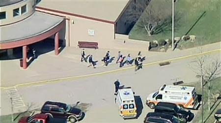 People leave Franklin Regional High School after reports of stabbing injuries in Murrysville, Pennsylvania April 9, 2014, in this still image taken from video courtesy of WPXI. REUTERS/WPXI/Handout via Reuters