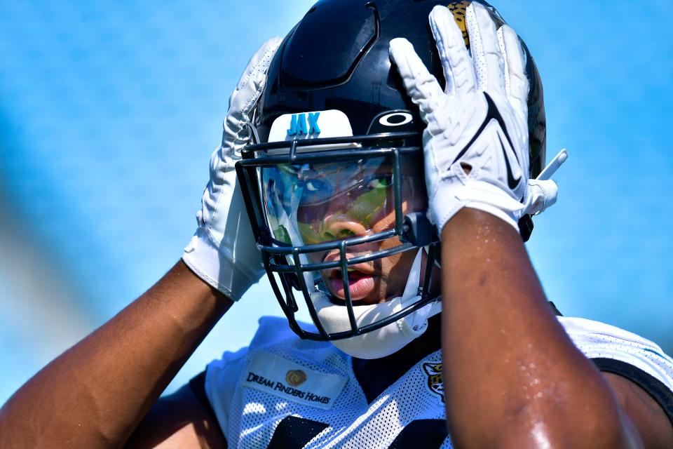 Jacksonville Jaguars outside linebacker Travon Walker (44) adjusts his helmet during the Jaguars minicamp session at TIAA Bank Field in Jacksonville, FL Wednesday, June 15, 2022.