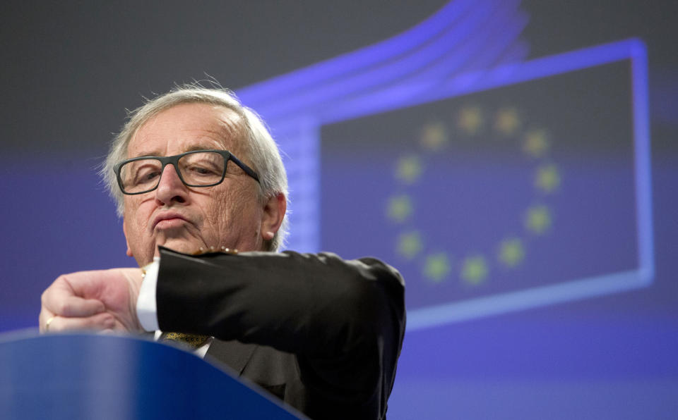 FILE - In this Wednesday, Feb. 21, 2018 file photo European Commission President Jean-Claude Juncker looks at his watch at the end of a media conference at EU headquarters in Brussels. (AP Photo/Virginia Mayo, File)