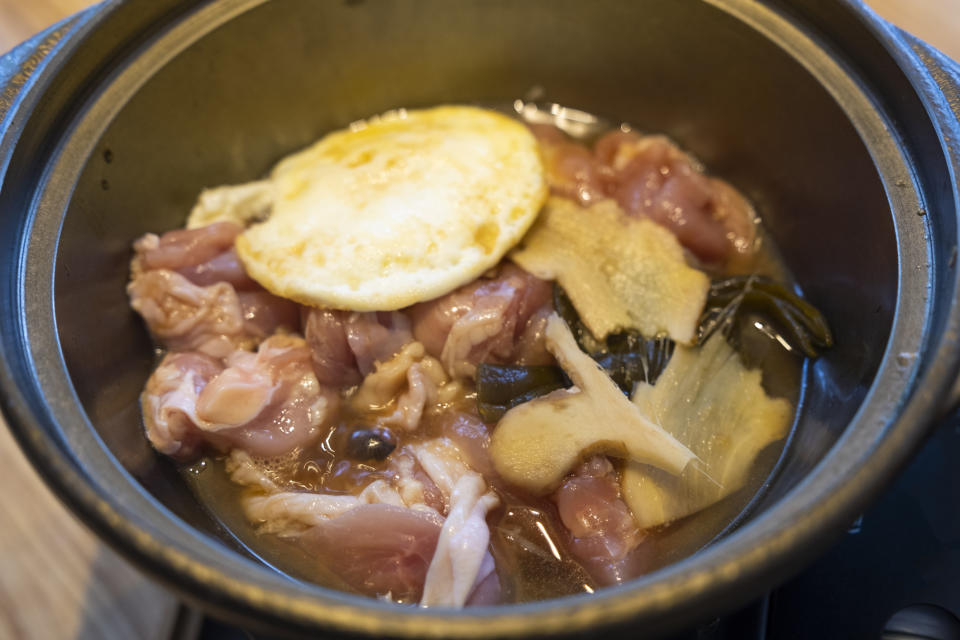 meat and aromatics in a crock pot