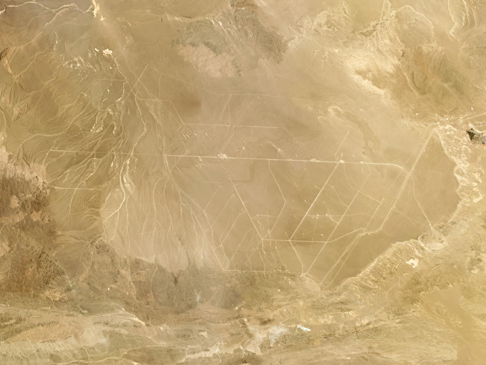 This composite photo of satellite images taken in June 2021 provided by Planet Labs Inc. shows what analysts believe is a field of intercontinental ballistic missile silos near Hami, China. The U.S. military is warning about what analysts have described as a major expansion of China's nuclear missile silo fields, at a time of heightened tension between the U.S. and China. (Planet Labs Inc. via AP)