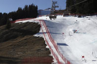 FILE - An athlete speeds down the course during an alpine ski, men's World Cup giant slalom race, in Adelboden, Switzerland, Saturday, Jan. 7, 2023. Mother Nature and global warming are having just as much say about when and where to hold ski races these days as the International Ski Federation. (AP Photo/Gabriele Facciotti, File)