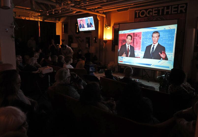 SAN FRANCISCO, CALIFORNIA - NOVEMBER 30: People watch a debate between California Gov. Gavin Newsom and Florida Gov. Ron DeSantis during a watch party at Manny's on November 30, 2023 in San Francisco, California. Newsom and DeSantis were hosted by Sean Hannity on Fox. (Photo by Justin Sullivan/Getty Images)
