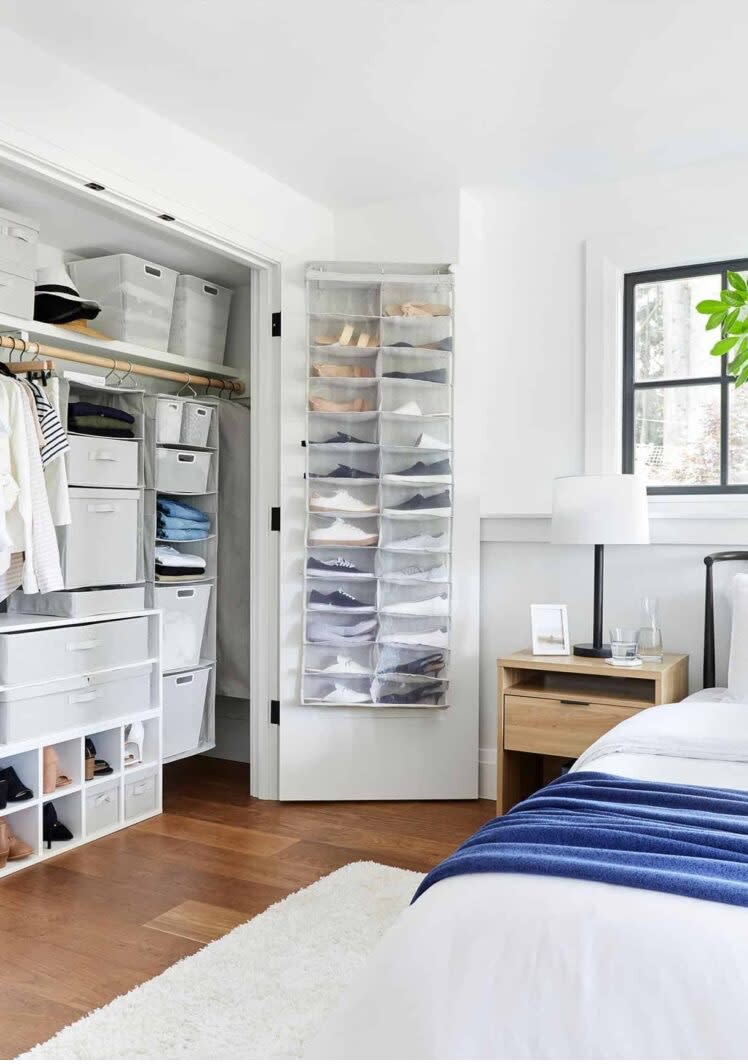 Shoe storage hanging from the back of a bedroom closet door