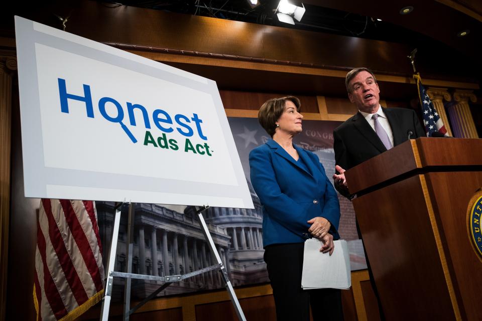 Sens. Amy Klobuchar of Minnesota and Mark Warner of Virginia introduce the Honest Ads Act in 2017.