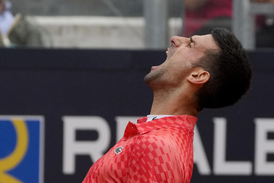 Serbia's Novak Djokovic shouts during the quarter final match against Denmark's Holger Rune at the Italian Open tennis tournament, in Rome, Wednesday, May 17, 2023. (AP Photo/Gregorio Borgia)