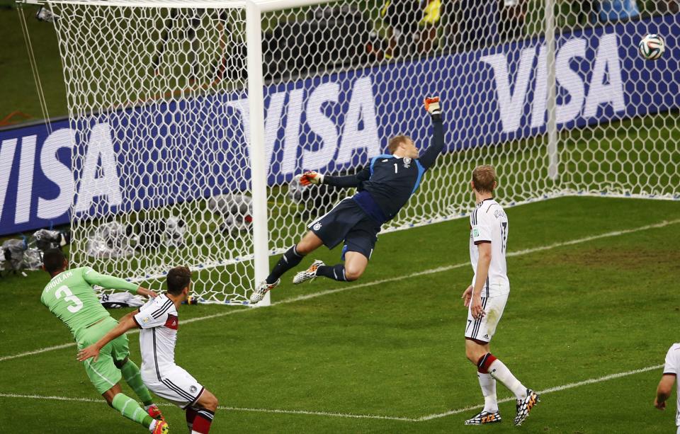 Algeria's Faouzi Ghoulam (L) misses a scoring opportunity during their 2014 World Cup round of 16 game against Germany at the Beira Rio stadium in Porto Alegre June 30, 2014. REUTERS/Leonhard Foeger