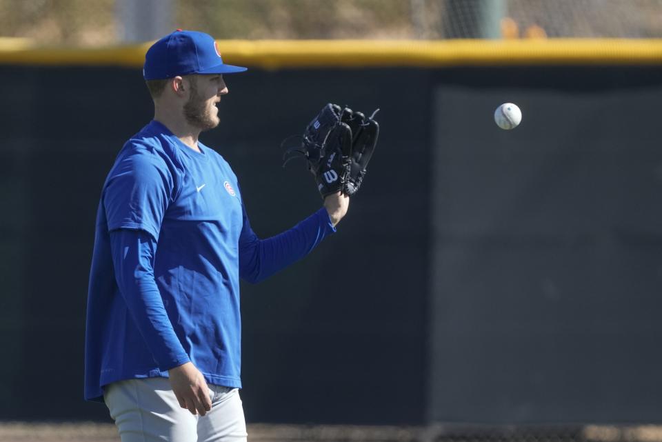 Chicago Cubs' Jameson Taillon catches a ball during a spring training baseball workout Wednesday, Feb. 15, 2023, in Mesa. (AP Photo/Morry Gash)