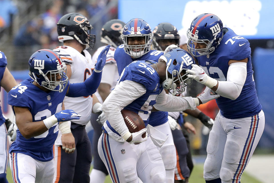 New York Giants outside linebacker Alec Ogletree, center, celebrates his of Chicago Bears quarterback Chase Daniel, not pictured, with teammates defensive back Grant Haley (34), outside linebacker Kareem Martin (96) and defensive end Kerry Wynn (72) during the first half of an NFL football game, Sunday, Dec. 2, 2018, in East Rutherford, N.J. (AP Photo/Seth Wenig)