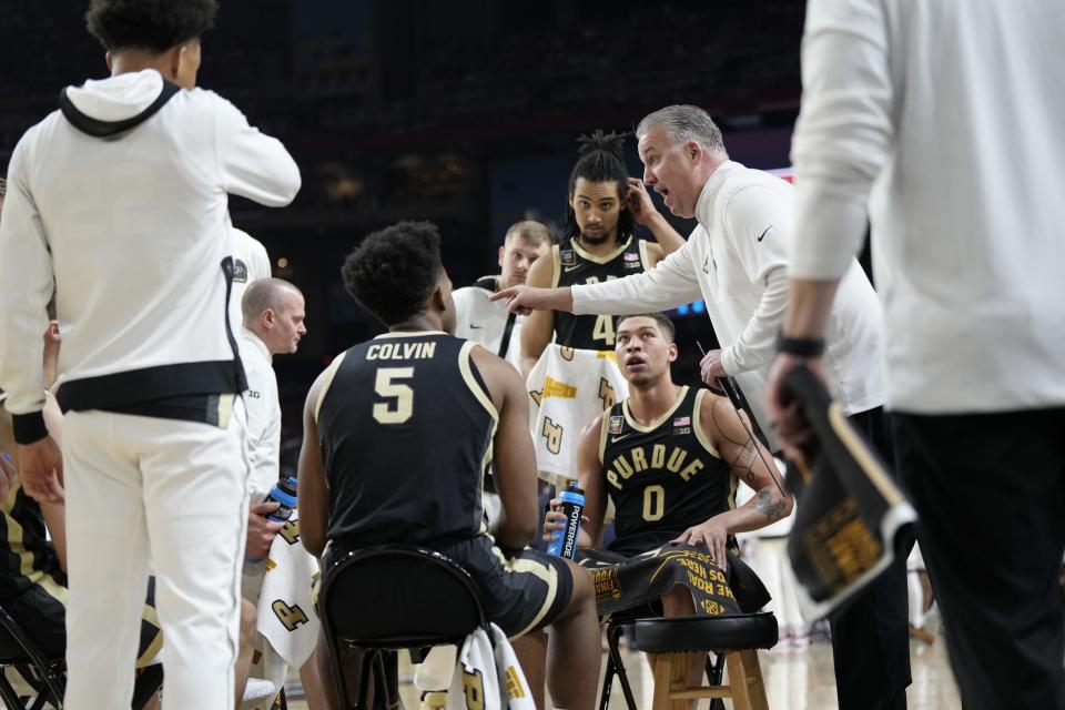 Purdue Boilermakers head coach Matt Painter talks to his team during a timeout at the Men's NCAA national championship game against the Connecticut Huskies at State Farm Stadium in Glendale on April 8, 2024.