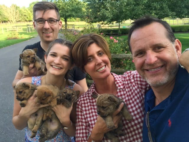 Dr. Joe Rossi smiles alongside his wife, Jill; daughter, Alexa; and son-in-law, Phillip Michelfelder. All three of the couple’s adult children inherited their parents' love of animals.  (Photo courtesy of Dr. Joseph Rossi)