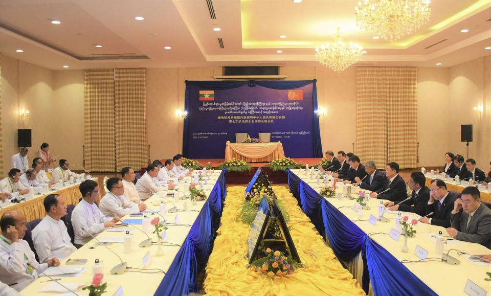 In this photo released from the The Military True News Information Team on Oct.30, 2023, representatives of Myanmar State Administration Council, left side, led by Home Affair Minister Lt-Gen Yar Pyae meet with Chinese representatives, right side, led by Wang Xiaohong, Chinese Minister for public security, in Naypyitaw, Myanmar. (The Military True News Information Team via AP)