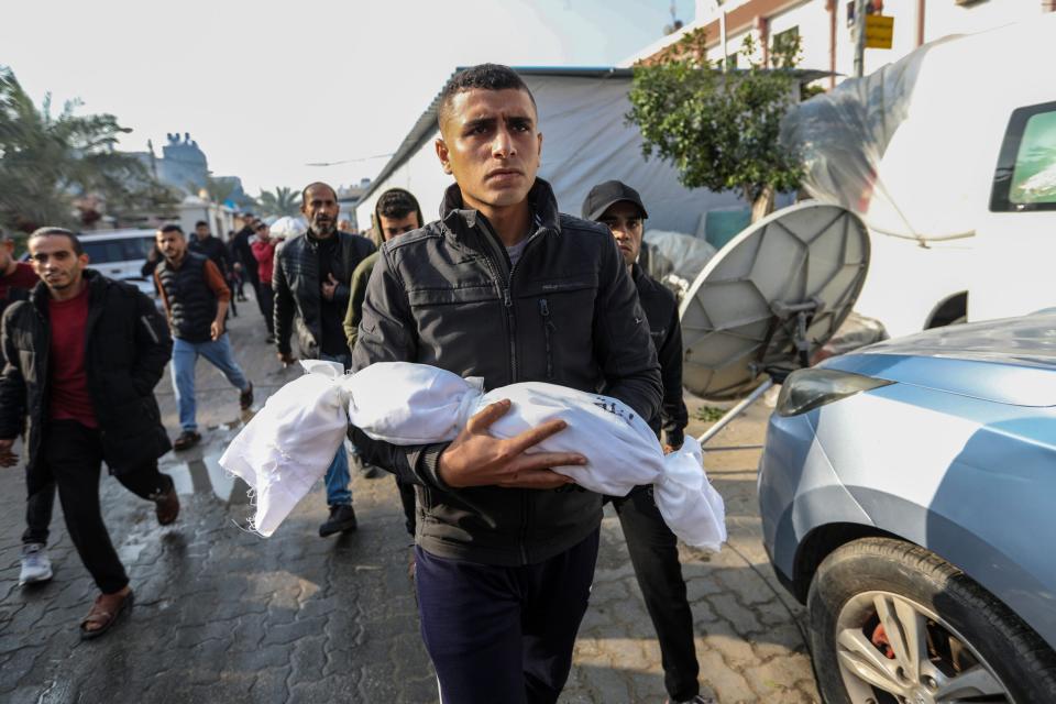 People mourn as they collect the bodies of Palestinians killed in an airstrike on December 1, 2023 in Khan Yunis, Gaza. (Photo by Ahmad Hasaballah/Getty Images)