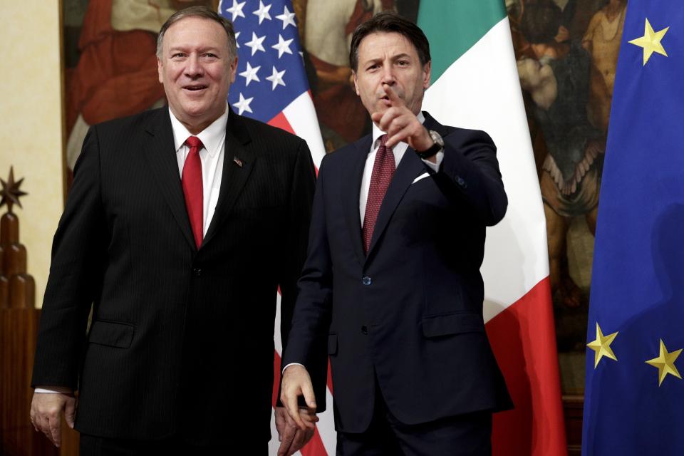 Italian Premier Giuseppe Conte, right, and U.S. Secretary of State, Mike Pompeo pose for the media following their meeting at Chigi Palace premier's office in Rome, Tuesday, Oct. 1, 2019. U.S. Secretary of State Mike Pompeo is in Italy at the start of a four-nation tour of Europe as the push to impeach President Donald Trump gains steam at home. (AP Photo/Andrew Medichini)