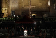 Pope Francis presides over the Via Crucis (Way of the Cross) torchlight procession in front of Rome's Colosseum on Good Friday, a Christian holiday commemorating the crucifixion of Jesus Christ and his death at Calvary, in Rome, Friday, April 19, 2019. (AP Photo/Gregorio Borgia)