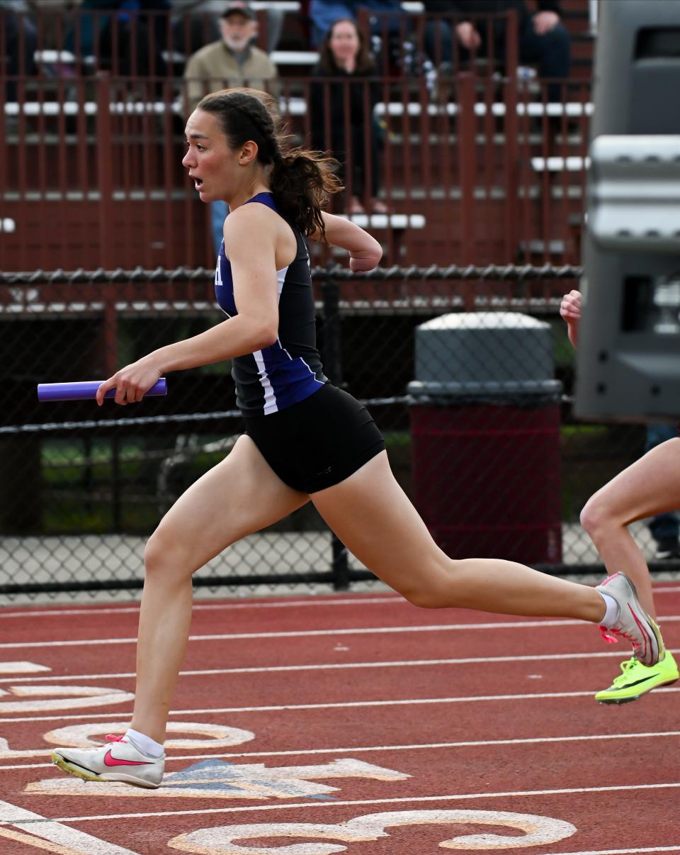 Bloomington South’s Violet Hall anchors the girls' 400-meter relay during the Conference Indiana track meet at Bloomington North on Friday, April 26, 2024.