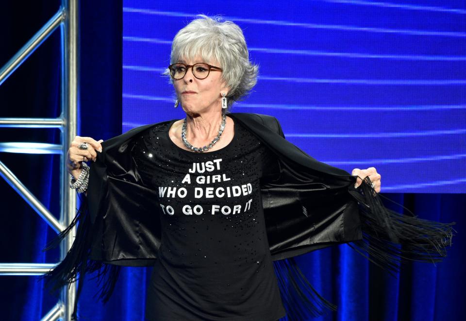 Rita Moreno shows off her T-shirt onstage during the 2018 Television Critics Association Summer Press Tour.