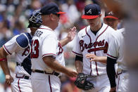 Atlanta Braves manager Brian Snitker (43) relieves starting pitcher Tucker Davidson in the sixth inning of a baseball game against the Washington Nationals, Thursday, June 3, 2021, in Atlanta. (AP Photo/John Bazemore)