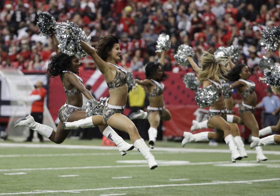 <p>Atlanta Falcons cheerleaders wearing Salute to Service costumes perform during the first of an NFL football game between the Atlanta Falcons and the Arizona Cardinals, Sunday, Nov. 27, 2016, in Atlanta. (AP Photo/David Goldman) </p>