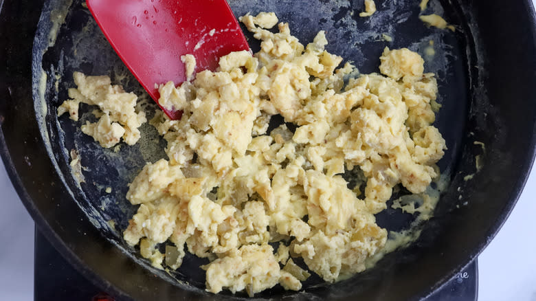 scrambled eggs in a cast iron skillet