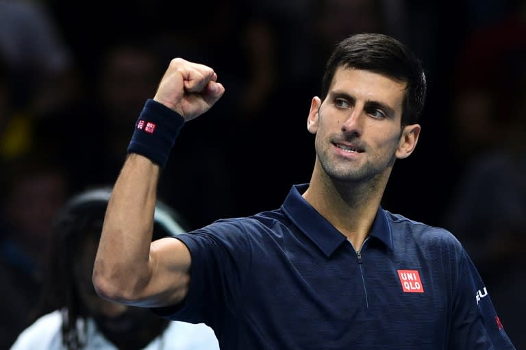 Serbia's Novak Djokovic celebrates victory against Belgium's David Goffin at the ATP World Tour Finals in London on November 17, 2016