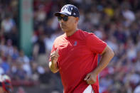 Boston Red Sox manager Alex Cora leaves the field after visiting the mound during the eighth inning of a baseball game against the Tampa Bay Rays at Fenway Park, Monday, July 4, 2022, in Boston. (AP Photo/Mary Schwalm)