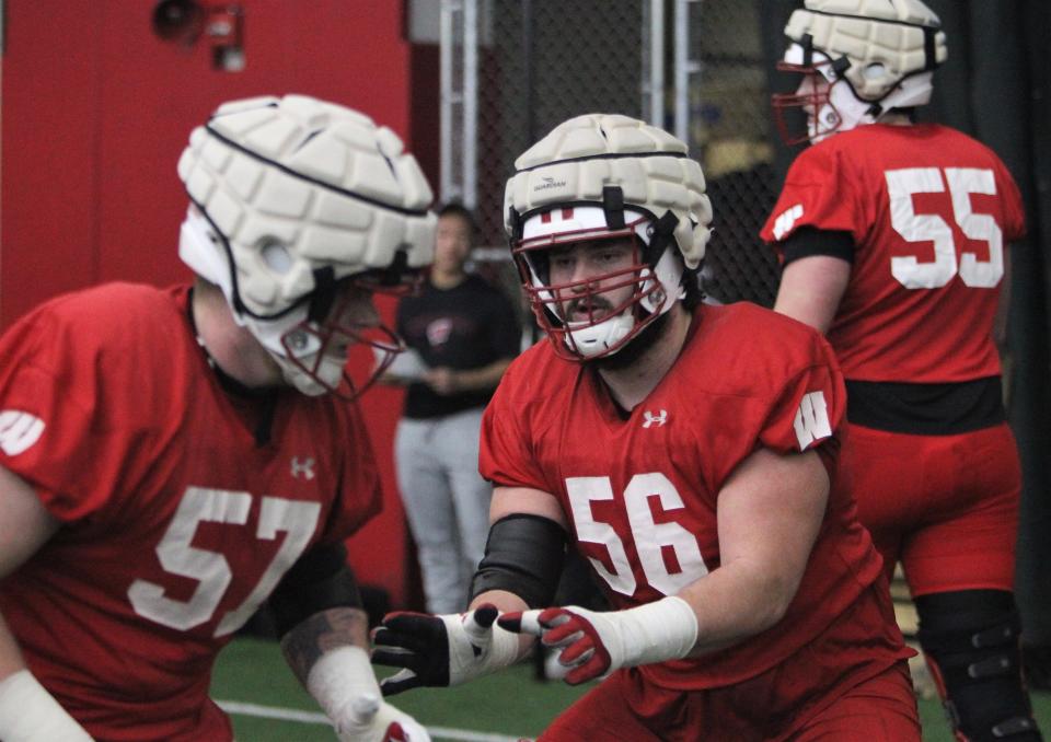 Wisconsin offensive linemen Joe Brunner (56) goes through drills with Jake Renfro during spring practice. Brunner worked mostly on special teams last season, but says he's ready for more playing time on offense.