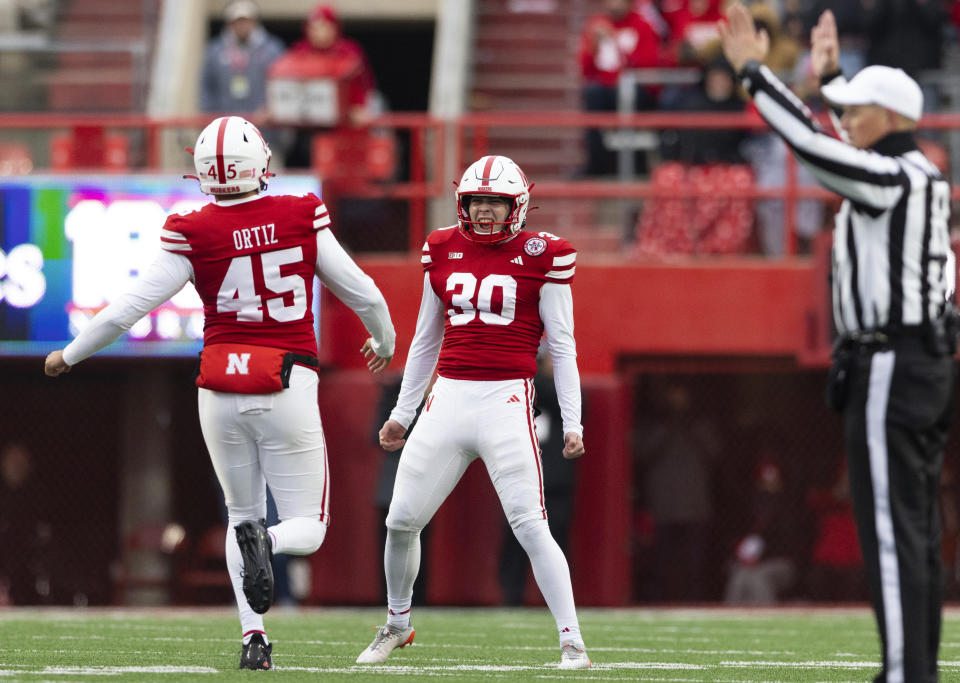 Nebraska kicker Tristan Alvano (30) celebrates with Marco Ortiz (45) after kicking a 55-yard field goal against Purdue during the second half of an NCAA college football game Saturday, Oct. 28, 2023, in Lincoln, Neb. (AP Photo/Rebecca S. Gratz)