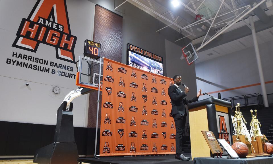 Former Ames High basketball player and NBA star Harrison Barnes speaks during the Ames High School's new Harrison Barnes Gymnasium and Court dedication ceremony at the school Thursday.