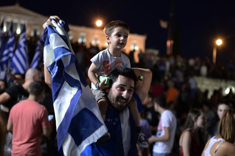 People gather to celebrate in Athens on July 5, 2015 after the first exit-polls of the Greek referendum