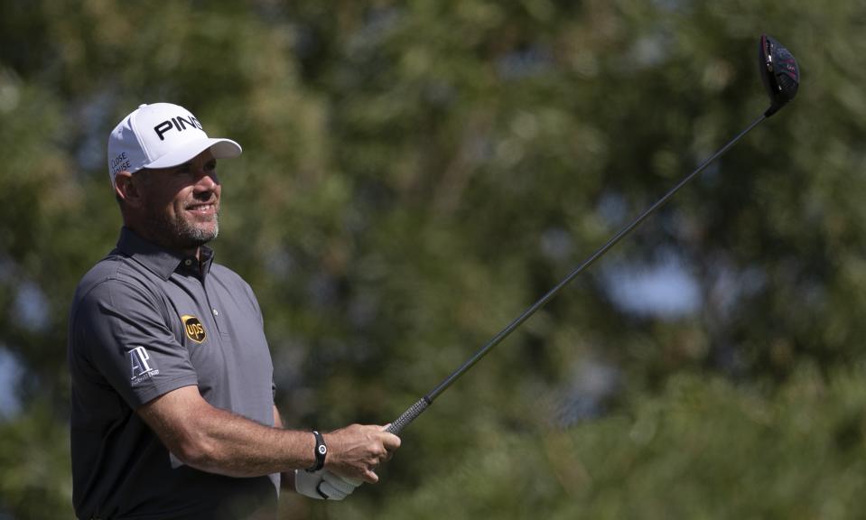 England's Lee Westwood follows his ball on the 3rd hole during the final round of the Abu Dhabi Championship golf tournament in Abu Dhabi, United Arab Emirates, Sunday, Jan. 19, 2020. (AP Photo/Kamran Jebreili)