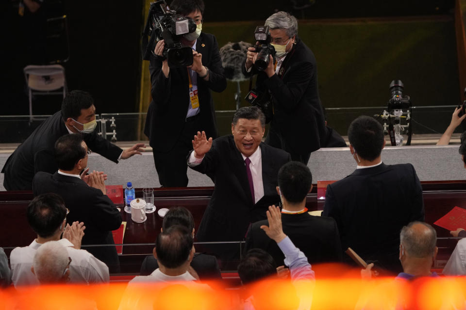 FILE - In this June 28, 2021, file photo, Chinese President Xi Jinping waves as he attends a gala show ahead of the 100th anniversary of the founding of the Chinese Communist Party in Beijing. An avalanche of changes launched by China's ruling Communist Party has jolted everyone from tech billionaires to school kids. Behind them: Xi's vision of reviving an idealized early era of vigorous party leadership, with more economic equality and tighter control over society and billionaire entrepreneurs. (AP Photo/Ng Han Guan, File)