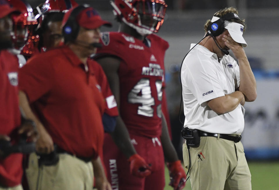 Florida Atlantic coach Lane Kiffin looks down during the second half of the team's NCAA college football game against UCF on Saturday, Sept. 7, 2019, in Boca Raton, Fla. (AP Photo/Jim Rassol)