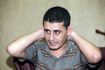 Saad Khalaf Ali, one of the 69 hostages rescued from an Islamic State prison in a joint raid by U.S. and Kurdish special forces, speaks during an interview with Reuters in Erbil, Iraq, October 29, 2015. REUTERS/Azad lashkari