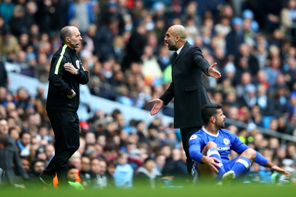 Pep Guardiola and Mike Dean disagree