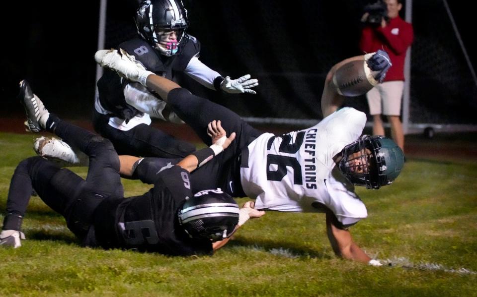 Ponaganset running back Jason Pincince battles to cross the goal line for a Chieftains touchdown in the second half. of Thursday's game against Pilgrim.