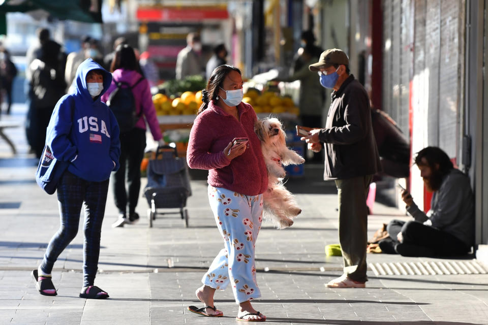 Shoppers wearing face masks at Bankstown in Sydney. Source: AAP